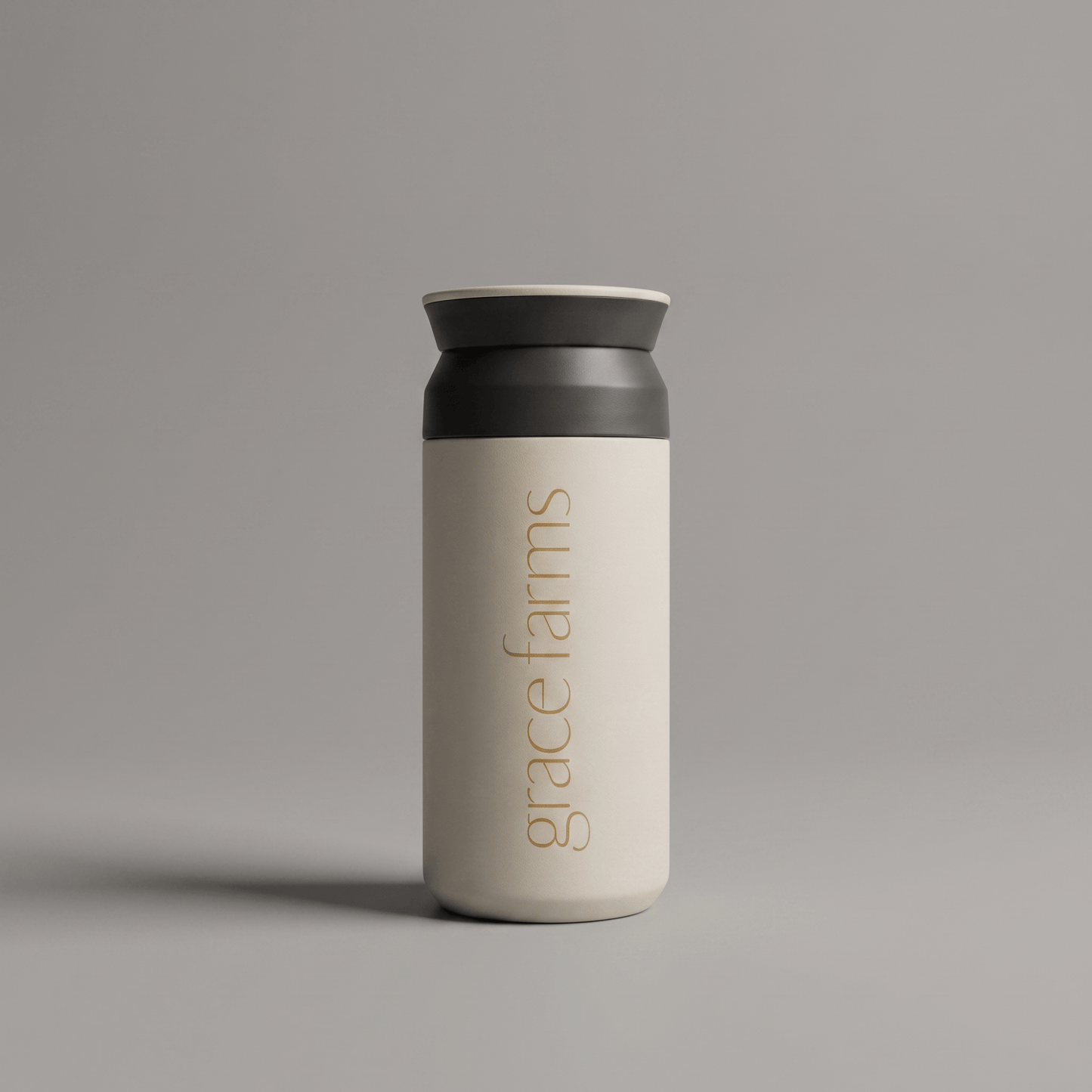 KINTO travel tumbler in white, featuring the vertical white text 'grace farms' on the front, set against a solid gray background.